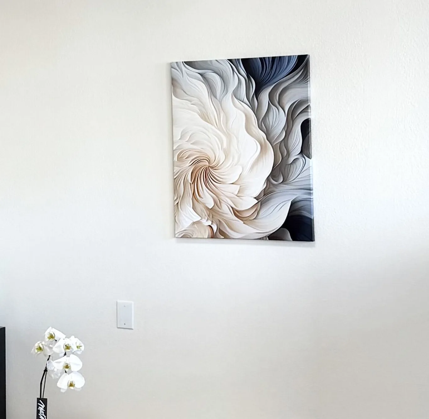 A white orchid under the flower painting in the Epic IV lounge