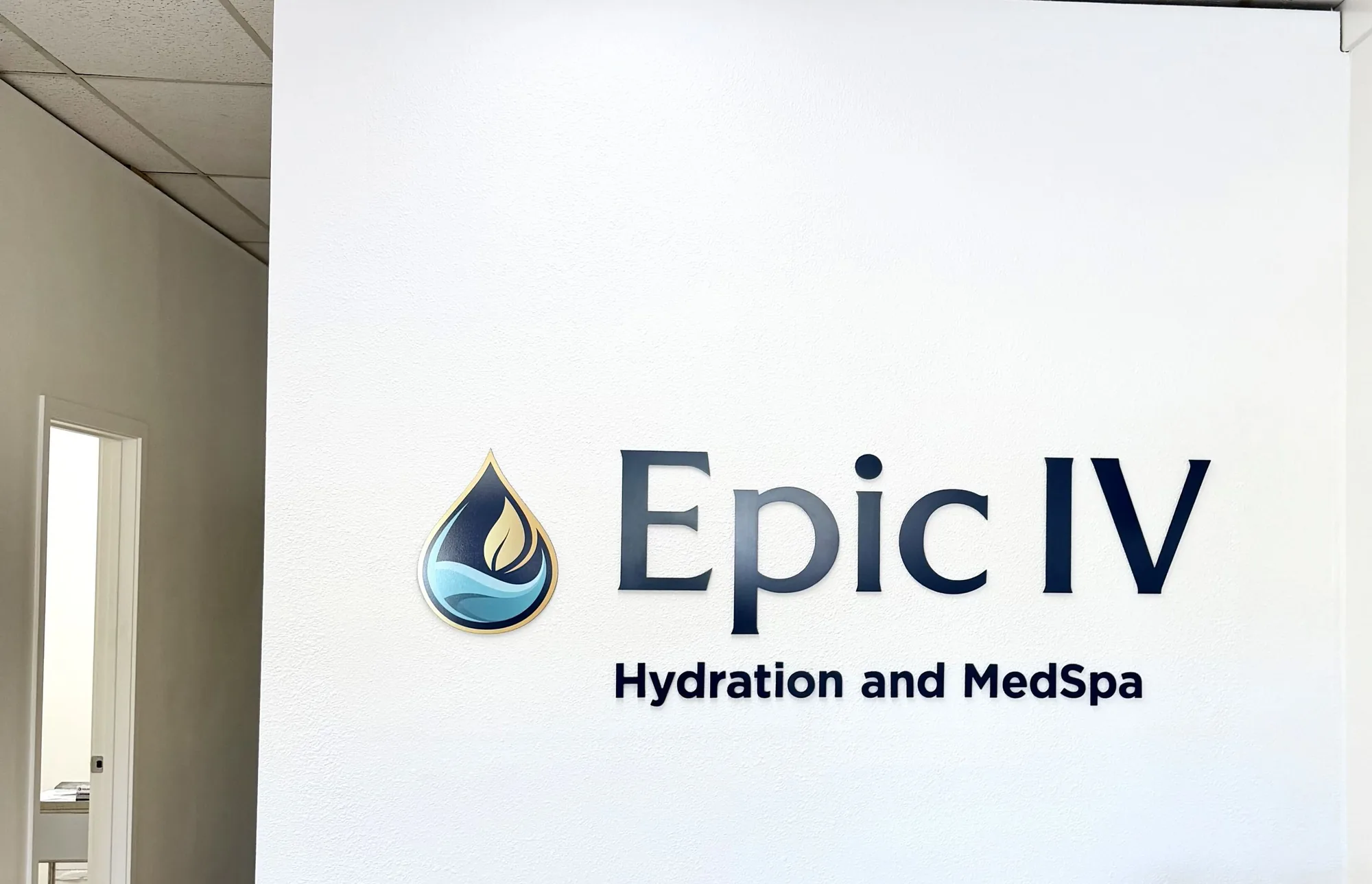 The Epic IV wordmark on the clinic wall, beside the open door to the private treatment rooms